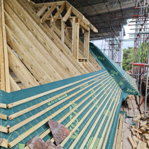 New timber roof battens installed over the breathable membrane in Weybridge