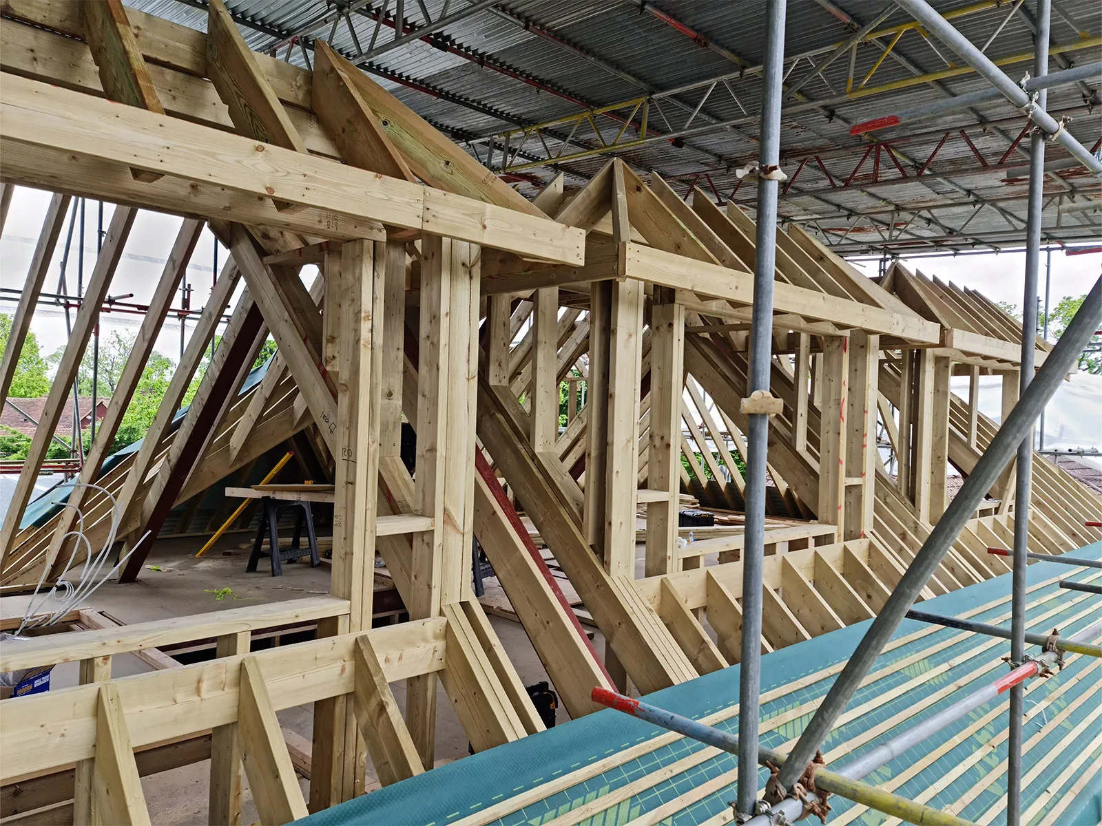 Loft conversion roof structure under construction in Weybridge by Art & Build Ltd construction company