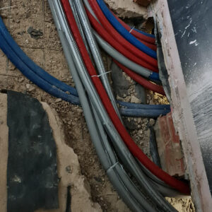 Heating and plumbing pipes routed beneath the floor during the Weybridge house refurbishment