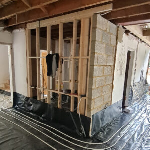Internal timber wall framing and floor services installed within the Weybridge house extension