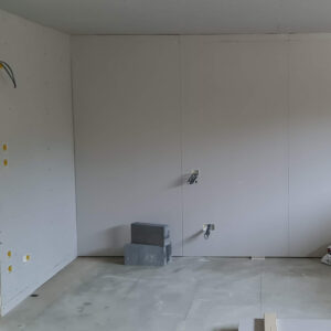 Open-plan room prepared for final fit-out during the Weybridge house refurbishment