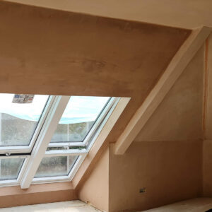 Loft bedroom with multiple Velux-style roof windows constructed by Croydon-based builders Art & Build Ltd