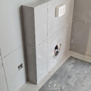 Wall-hung toilet frame and concealed cistern installed during the Weybridge bathroom refurbishment