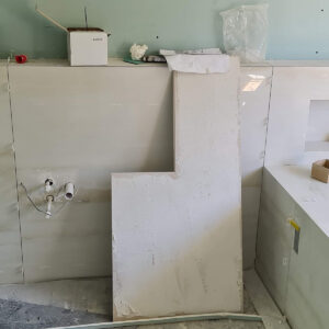 Bathroom fit-out in progress in Weybridge by Art & Build Ltd, a Croydon-based construction company
