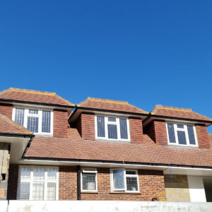 New loft conversion with three dormers constructed at the Weybridge property