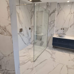 Luxury marble-effect bathroom completed in Weybridge by Croydon-based construction company Art & Build Ltd