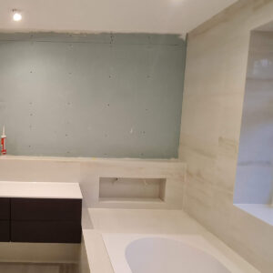 Bathroom wall preparation before tiling during the Weybridge refurbishment by Art & Build Ltd