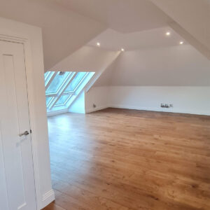 Completed loft conversion with multiple roof windows in Weybridge by Art & Build Ltd