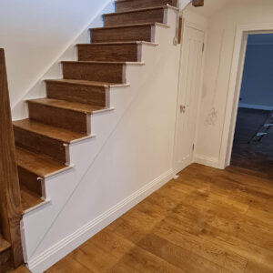 Completed oak staircase and flooring in Weybridge by Croydon-based builders Art & Build Ltd