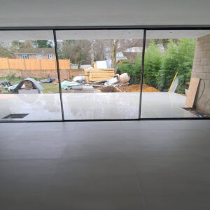Large sliding patio doors installed in the Weybridge house extension by Croydon-based builders Art & Build Ltd