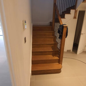Modern hallway and oak staircase completed by Croydon-based construction company Art & Build Ltd
