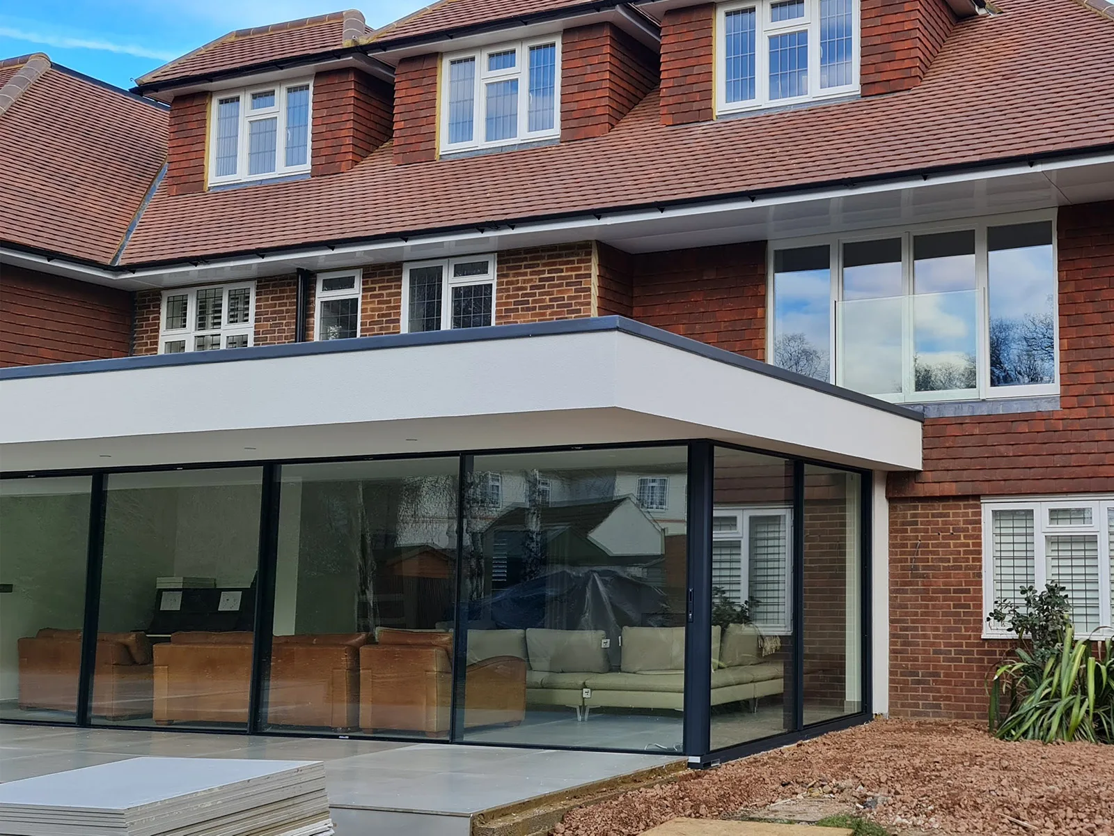 Rear house extension with corner glazing completed by Croydon-based builders Art & Build Ltd