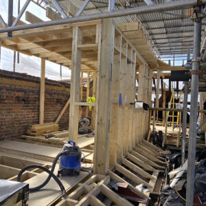 Internal timber wall framing and roof structure during a loft conversion, by Croydon loft conversion builders Art & Build Ltd