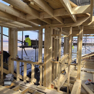 Rear dormer timber frame with floor joists and structural openings under construction, by Art & Build Ltd, a Croydon-based construction company