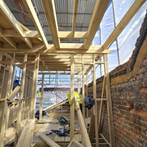 New timber roof joists and wall framing within a rear loft extension, by the Croydon-based team at Art & Build Ltd