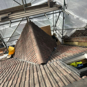 New brick parapet wall built beside an existing tiled roof, by Croydon loft conversion builders Art & Build Ltd