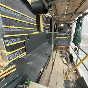 Breathable membrane, battens and slate cladding installed on a rear dormer, by the Croydon-based team at Art & Build Ltd
