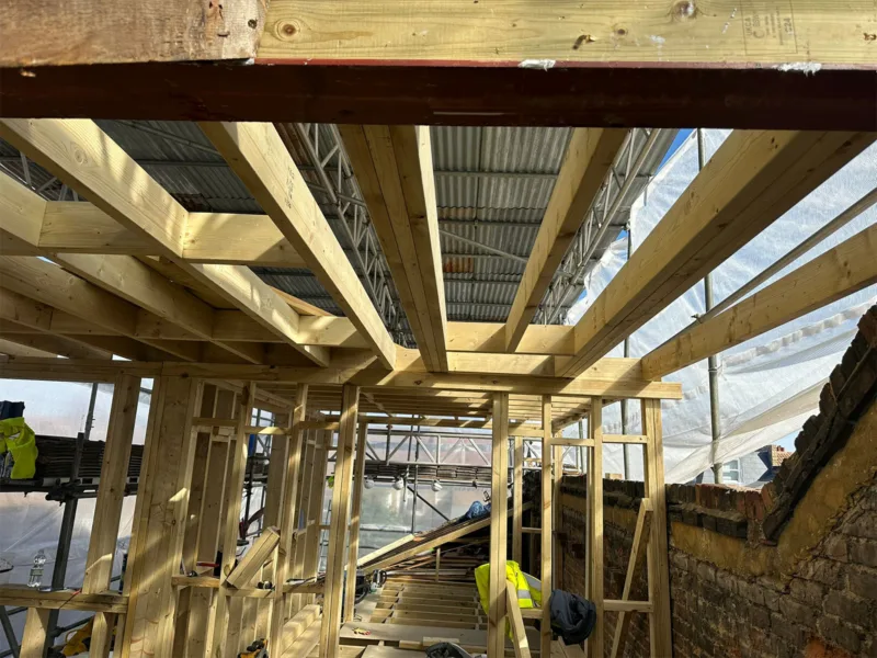 Structural timber roof and dormer framing viewed from inside the loft, by Croydon loft conversion builders Art & Build Ltd