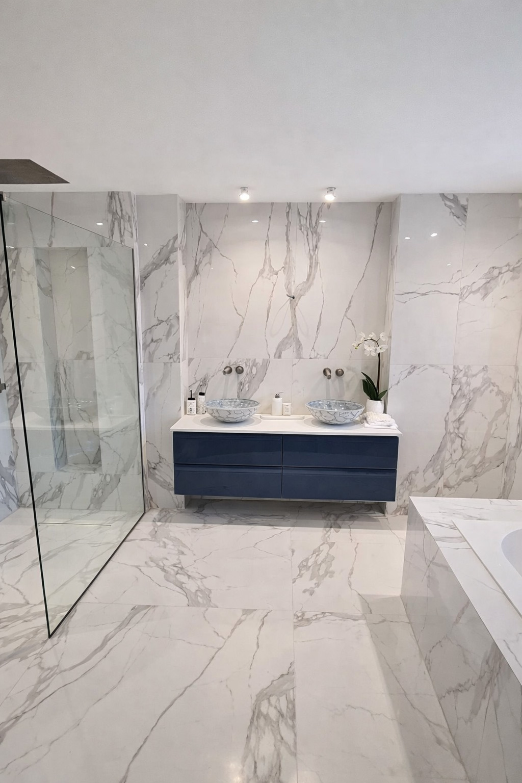 Completed modern bathroom in Weybridge by Croydon-based builders Art & Build Ltd