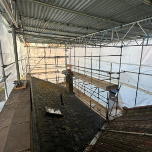 Existing roof prepared for stripping and structural loft conversion work under scaffolding