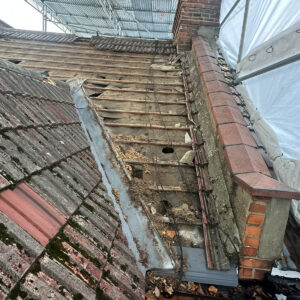Existing roof timbers and battens exposed after removal of the roof tiles during a loft conversion