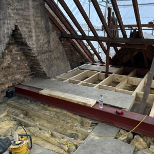 Structural steel beam installed across the new loft floor structure during a Southwark loft conversion