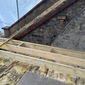 New timber loft floor joists fitted alongside a structural steel beam during a Southwark loft conversion