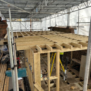 Timber framing forming the L-shaped dormer roof and supporting structure during a Southwark loft conversion