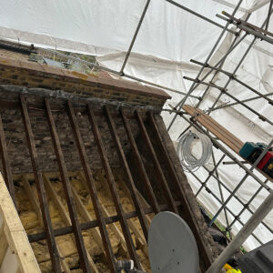 Existing roof section retained beside the new timber structure for the loft conversion roof terrace in Southwark