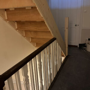 View from the loft landing towards a new bespoke timber staircase installed in a Southwark loft conversion