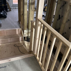 New staircase opening and timber balustrade during the first-fix stage of a Southwark loft conversion