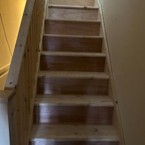 Bespoke timber loft staircase and handrail during installation in a Southwark property