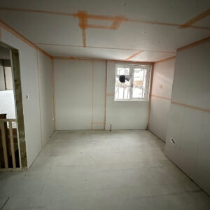 Plasterboard installed throughout a new loft bedroom during a conversion in Southwark