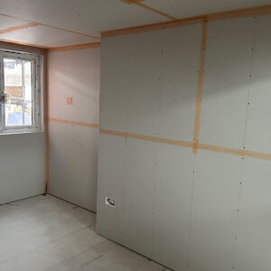 Plasterboard walls and ceiling with prepared joints in a new Southwark loft bedroom