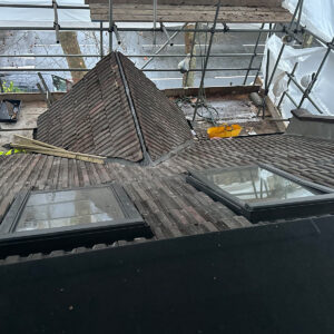 Retained pitched roof at the front of the house with two new VELUX windows installed during a Southwark loft conversion
