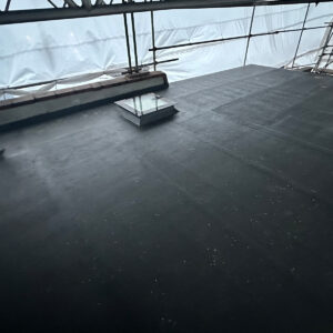 Waterproof roof covering installed across the new flat dormer roof with a rooflight in Southwark