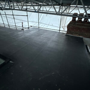 Wide view of the completed dormer flat roof around the chimney and rooflights in Southwark