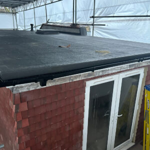 Completed rear dormer with a waterproof flat roof and glazed terrace doors in Southwark