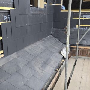 New slate roof and clad wall on an L-shaped loft conversion in Croydon, by Croydon-based builders Art & Build Ltd
