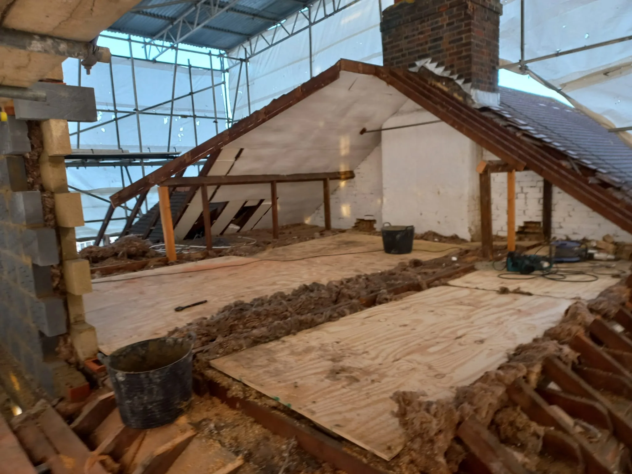 L-shaped loft conversion floor construction in progress by Art & Build Ltd in Croydon