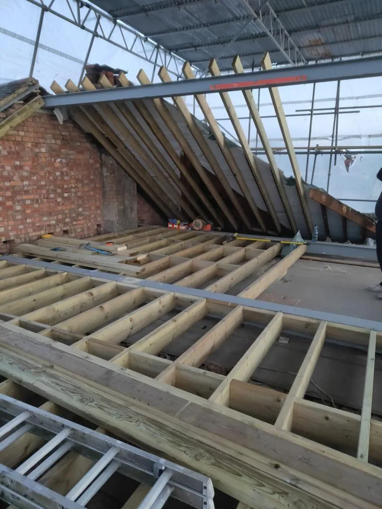 New floor joists installed during a loft conversion project by Art & Build Ltd in Croydon