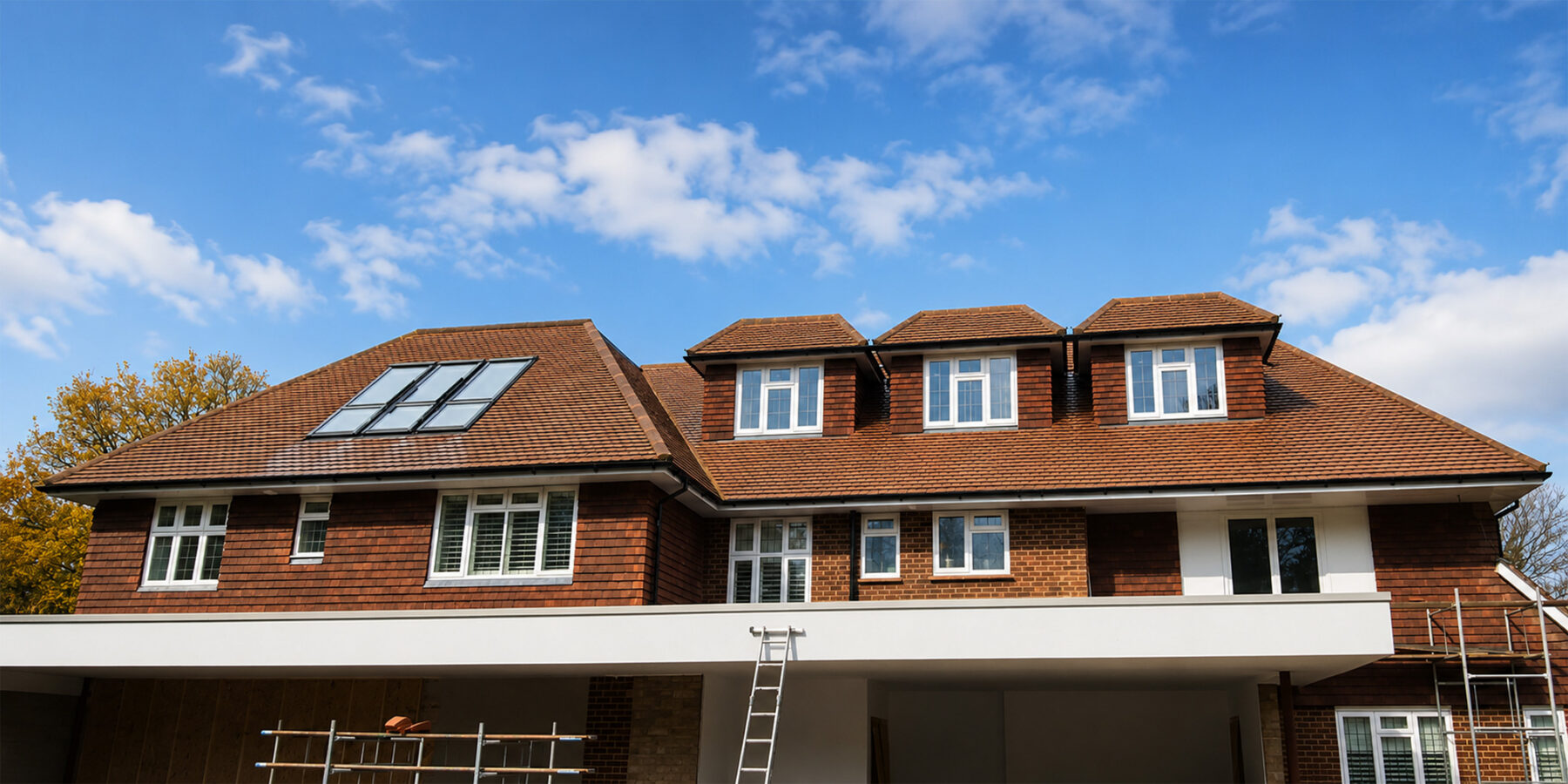 Completed house extension and loft conversion in Weybridge by Art & Build Ltd with dormer windows and Velux roof window