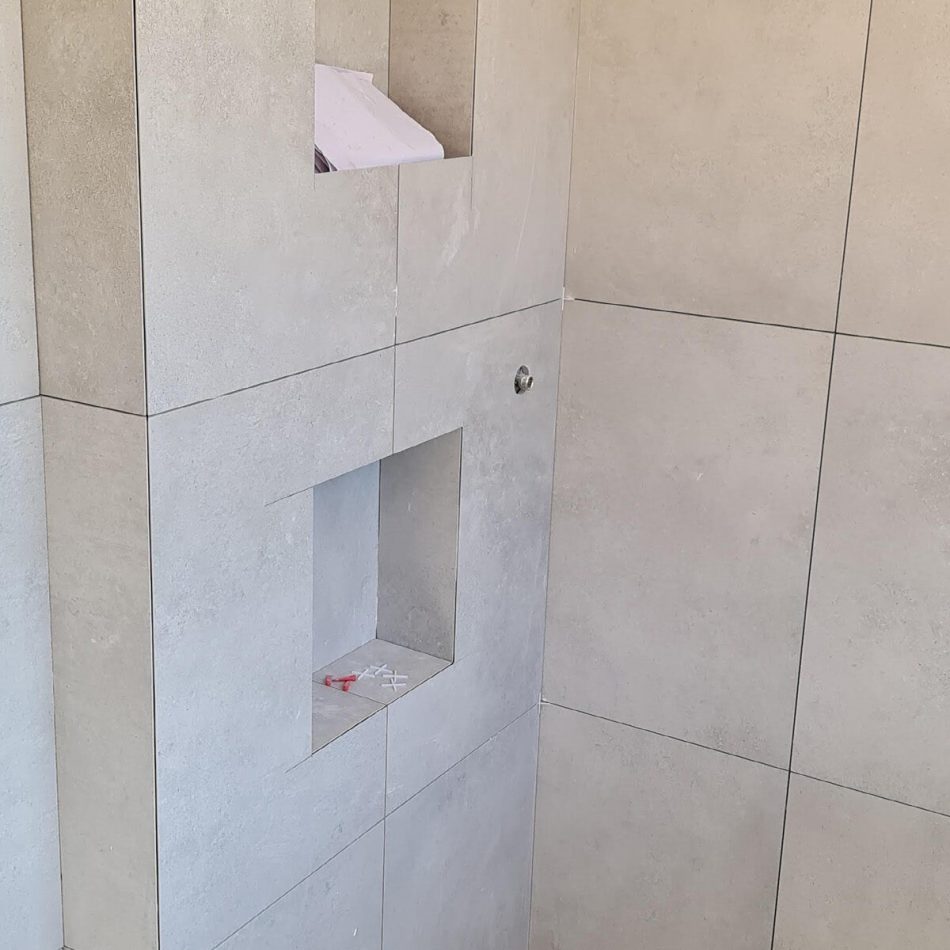 Built-in shower storage niches constructed by Croydon-based builders Art & Build Ltd in Weybridge