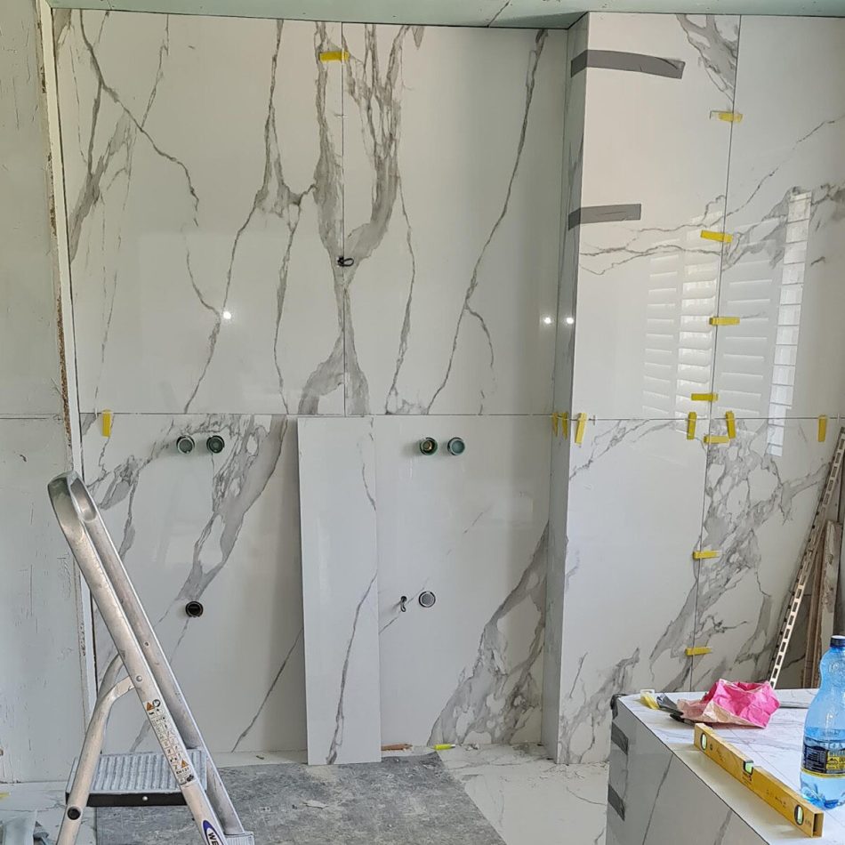 Luxury bathroom tiling installation in Weybridge by Croydon-based builders Art & Build Ltd