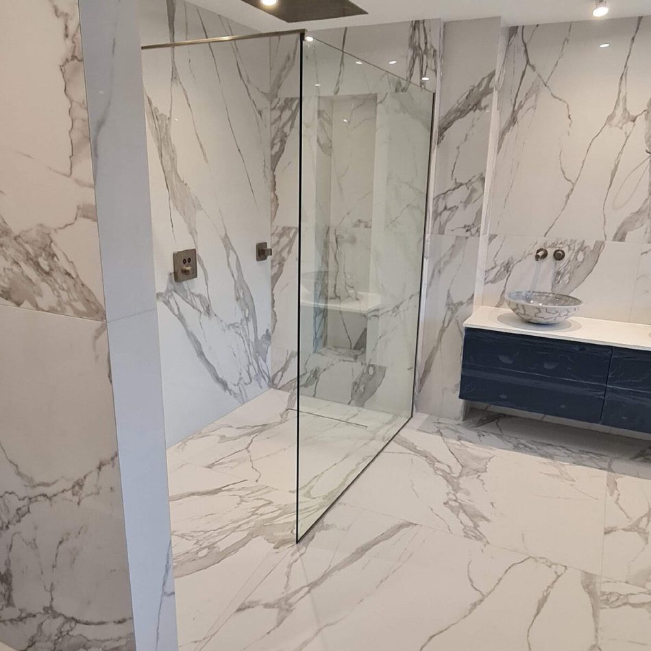 Luxury marble-effect bathroom completed in Weybridge by Croydon-based construction company Art & Build Ltd