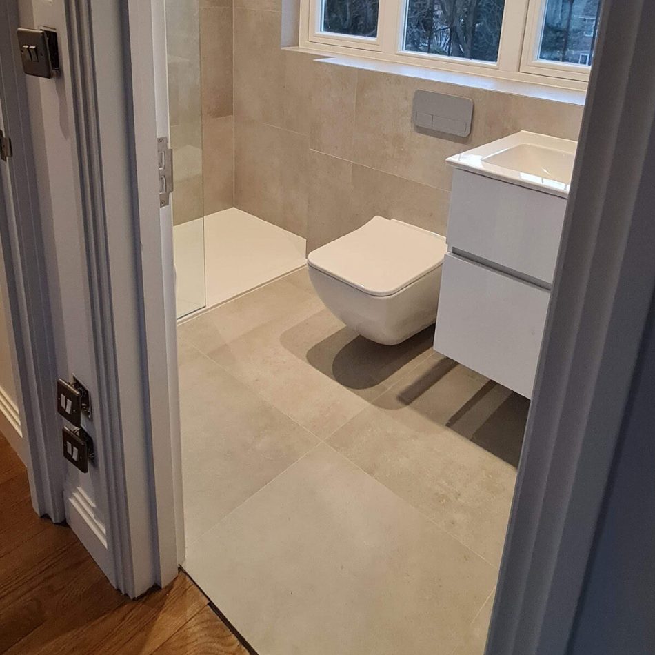 Modern family bathroom installation in Weybridge by Croydon-based builders Art & Build Ltd