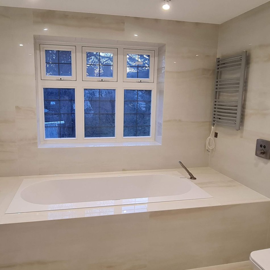 Modern bathroom with built-in bathtub completed in Weybridge by Croydon-based builders Art & Build Ltd